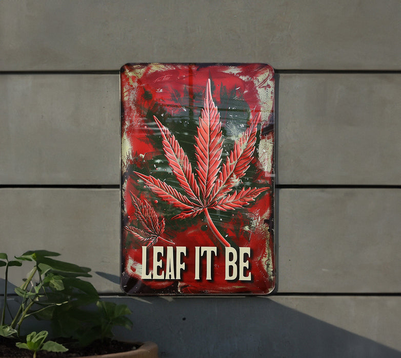 a metal sign that says leaf it be