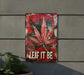 a metal sign that says leaf it be