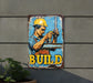 a sign on the side of a building that says build