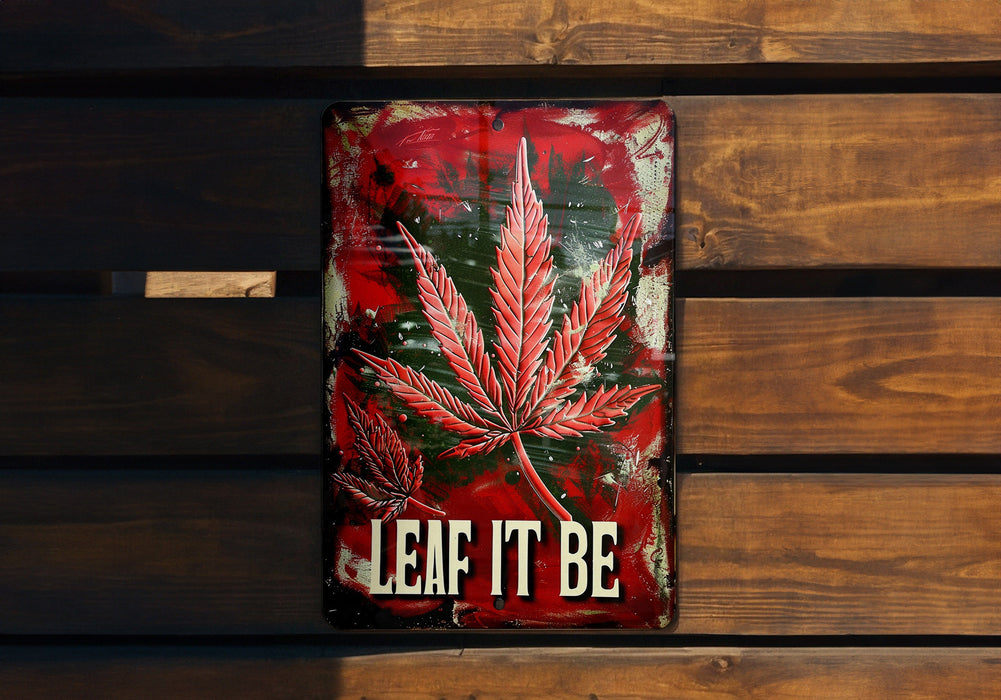a sign that says leaf it be on a wooden bench