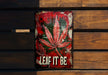 a sign that says leaf it be on a wooden bench