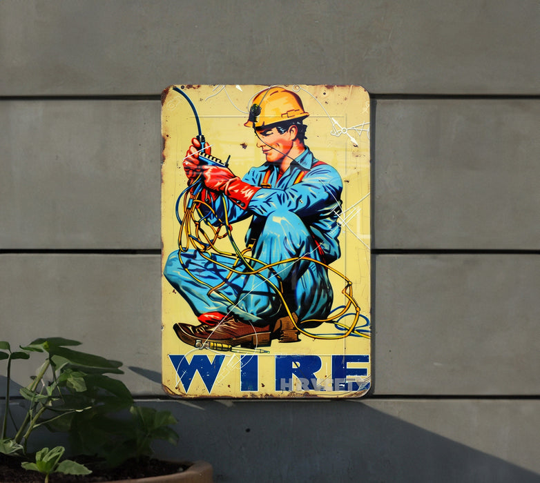 a yellow sign with a picture of a man holding a wire