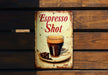 a sign that says espresso shot with a cup of coffee