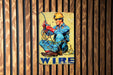 a painting of a man sitting on top of a wooden wall