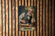 a painting of an old man is hanging on a wall