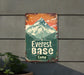 a sign on the side of a building advertising a camp