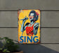 a sing sign on the side of a building