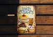a sign on a wooden wall that says bakery delights