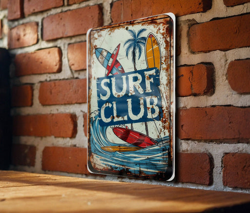 a surf club sign on a brick wall