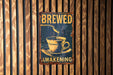 a sign on a wooden wall that reads brewed wakening