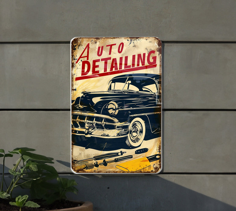 a metal sign that says auto detailing hanging on a wall