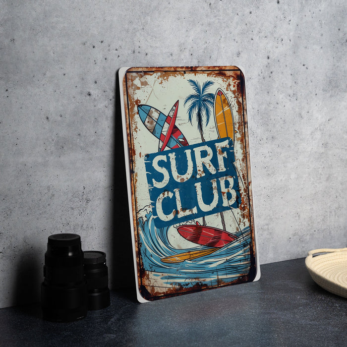 a surf club sign sitting on top of a table