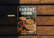 a sign that says bakery goods on it