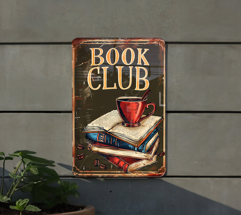 a book club sign hanging on the side of a building