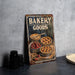 a sign that says bakery goods on it