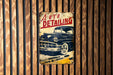 a sign on a wooden wall that says auto detailing