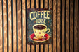 a sign on a wooden wall that says coffee house