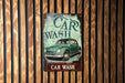 a car wash sign on a wooden wall