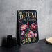 a sign that says bloom and grow on it