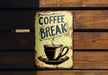 a sign that says coffee break with a cup of coffee