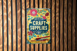 a sign on a wooden wall that says craft supplies