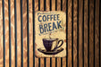 a coffee break sign on a wooden wall