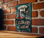 a sign on a brick wall that says culinary academy