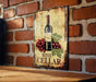 a picture of a wine cellar hanging on a brick wall