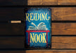 a book that is sitting on top of a wooden bench