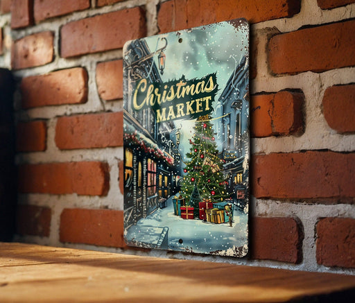 a picture of a christmas market hanging on a brick wall