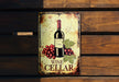 a metal sign with a bottle of wine on it