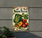 a vegetable patch sign hanging on the side of a building