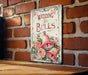 a wedding bells sign on a brick wall