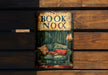a picture of a book nook on a wooden wall