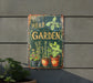 a herb garden sign hanging on the side of a building