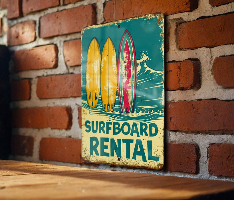 a surfboard rental sign on a brick wall