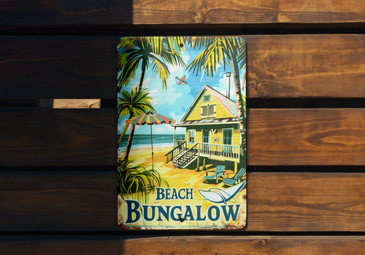 a beach bungalow sign hanging on a wooden wall