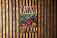 a sign on a wooden wall that says farm market