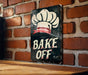 a sign on a brick wall that says bake off