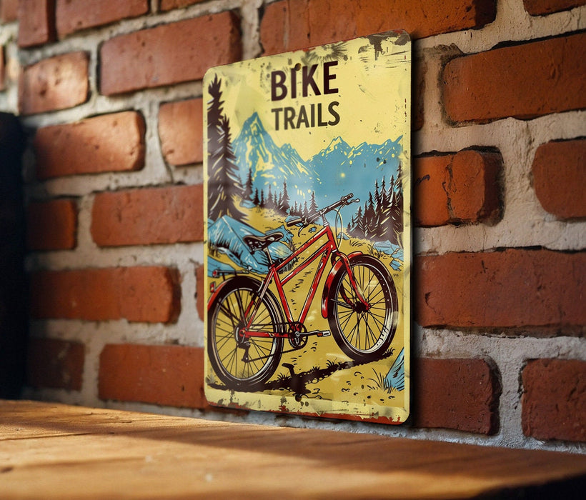 a bicycle trail sign on a brick wall