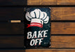 a sign that says bake off on it