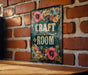 a sign on a brick wall that says craft room