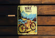 a bicycle trail book sitting on top of a wooden bench