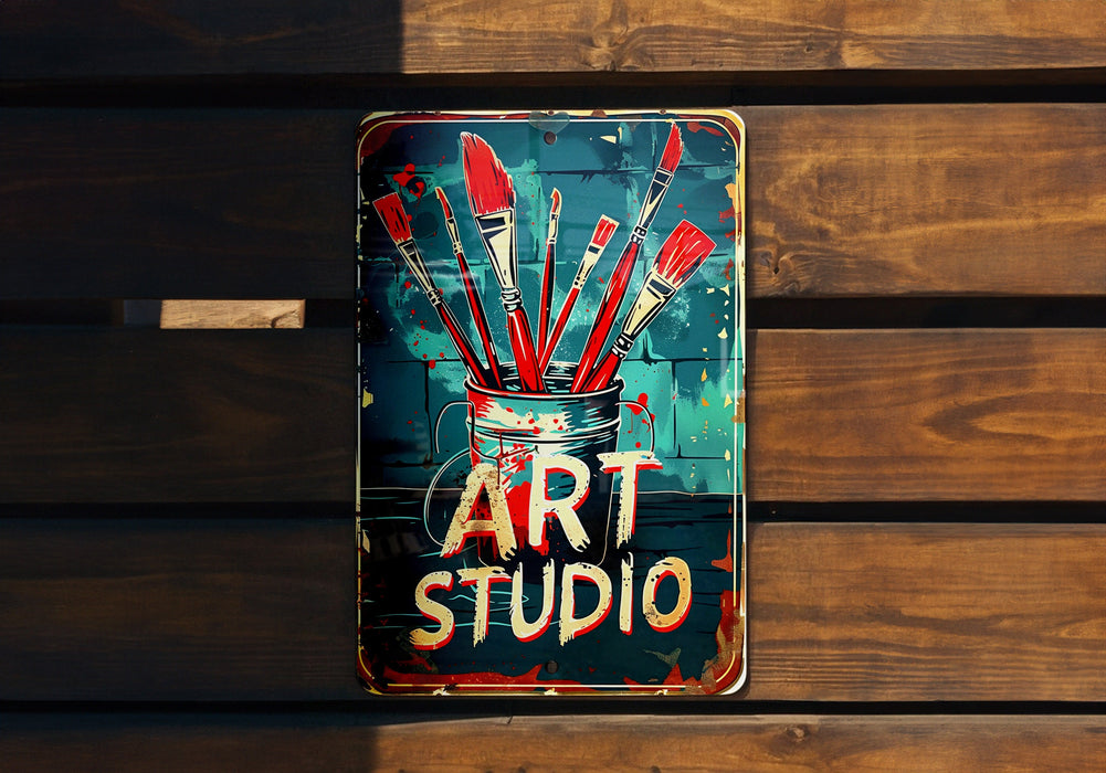 a sign that says art studio hanging on a wooden wall