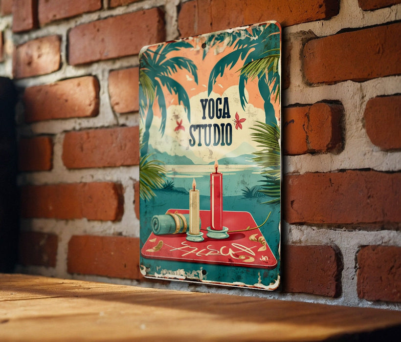 a picture of a yoga studio sign on a brick wall