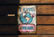a sign on a wooden wall that says travel dreams