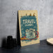 a travel journal sitting on a table next to a camera