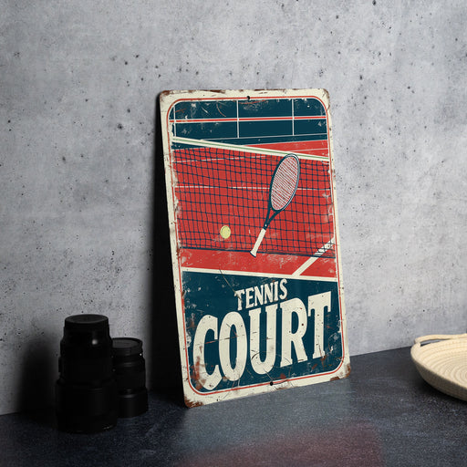 a tennis court sign sitting on top of a table