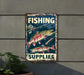 a fishing sign hanging on the side of a building