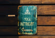 a sign on a wooden wall that says yoga retreat
